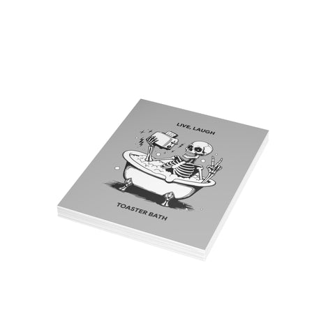 “Live, Laugh, Toaster Bath” Skeleton Bathtub Greeting Card — Humorous Greeting Card - Illustrated, Funny, Snarky, Modern