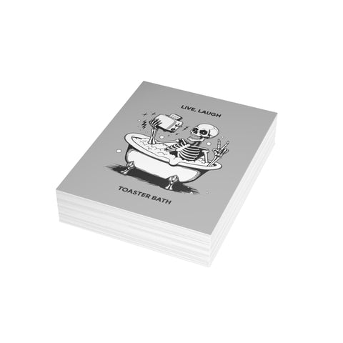 “Live, Laugh, Toaster Bath” Skeleton Bathtub Greeting Card — Humorous Greeting Card - Illustrated, Funny, Snarky, Modern